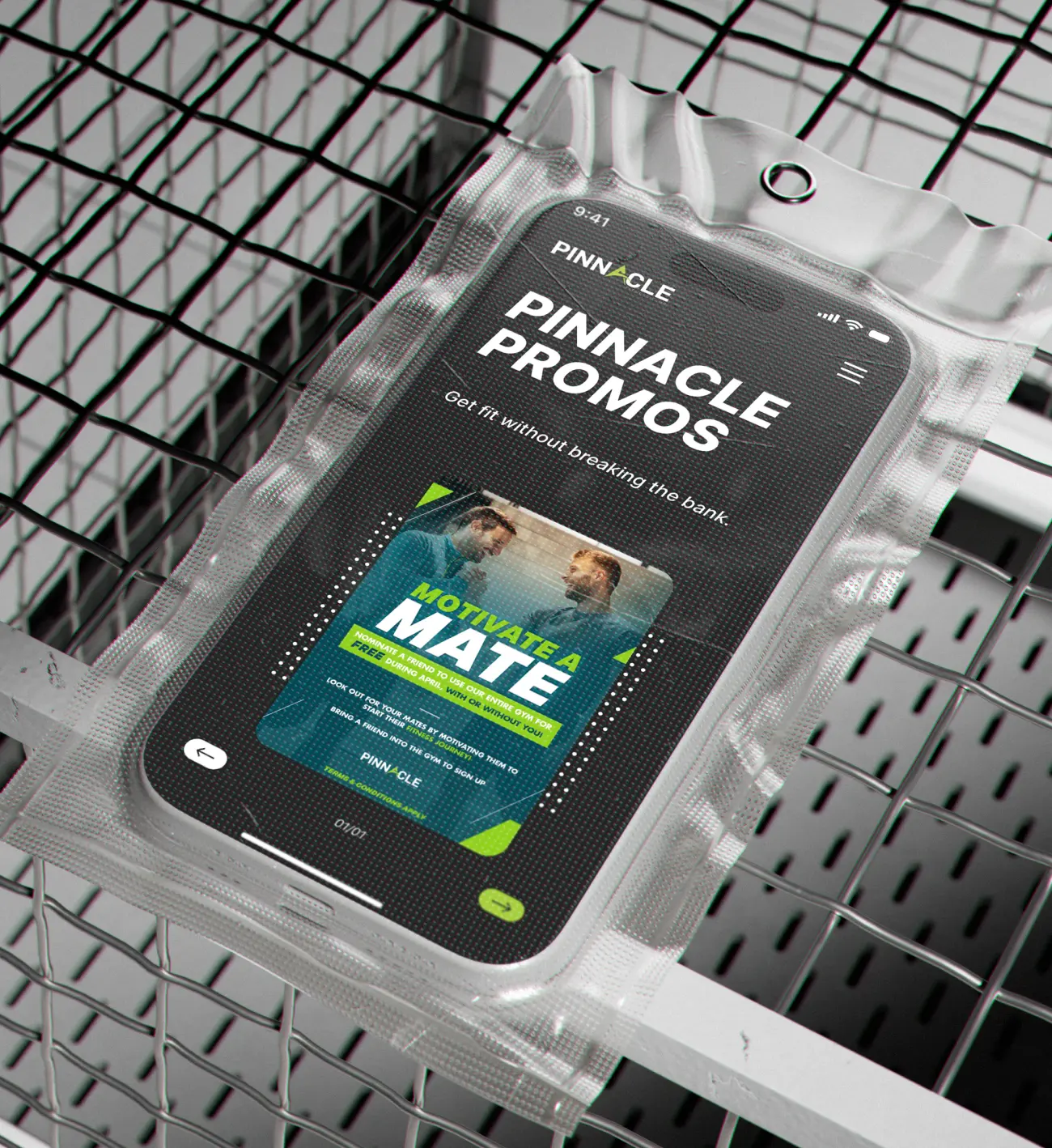 A smartphone in a protective plastic case displays a promotional fitness app screen with the text "Pinnacle Promos" and "Motivate a Mate" over an image of two people working out, embodying the pinnacle of fitness motivation.