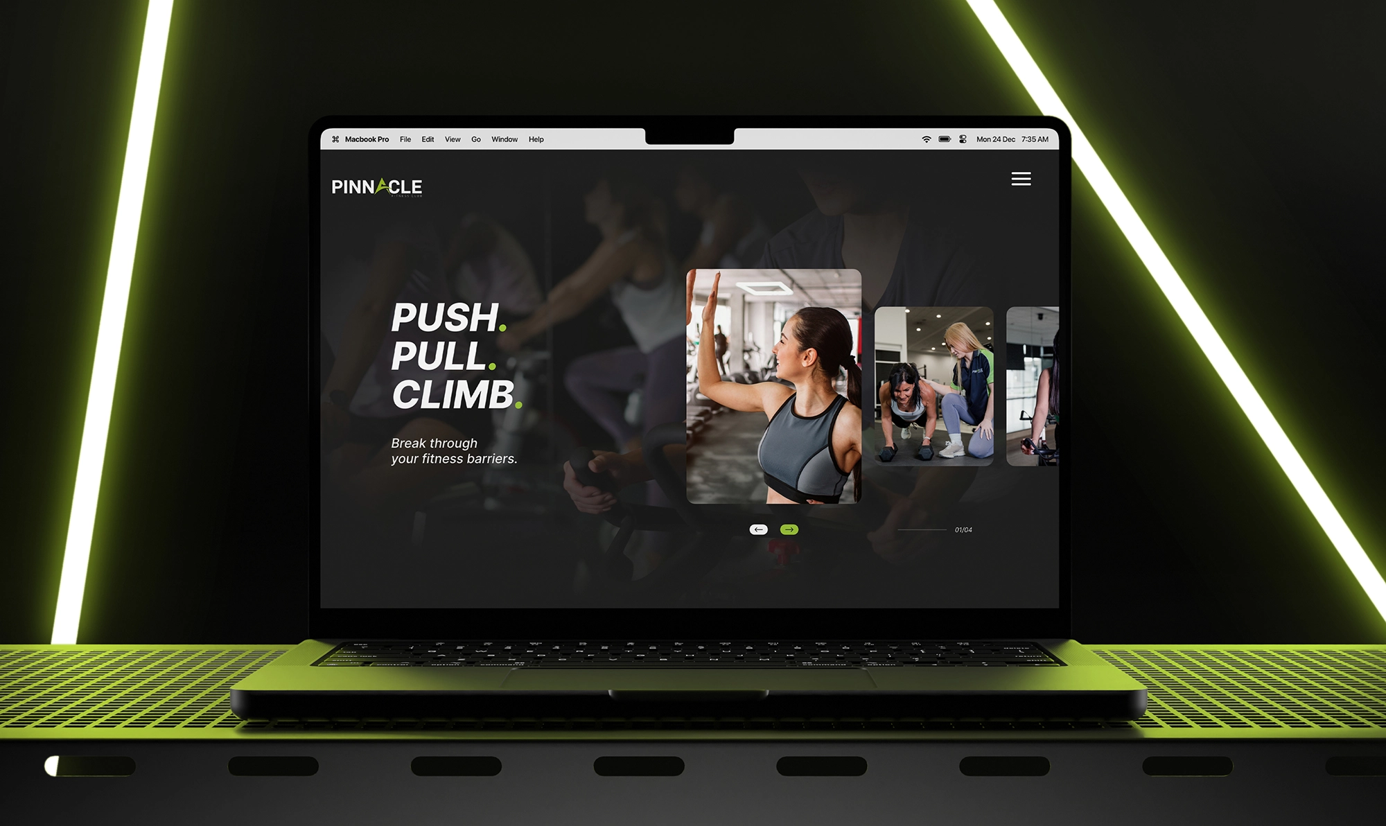 A laptop displaying a fitness website with the text "Push. Pull. Climb." and images of people exercising. The laptop, set on a perforated grid surface with a black and green color scheme, epitomizes the pinnacle of workout motivation and digital design.