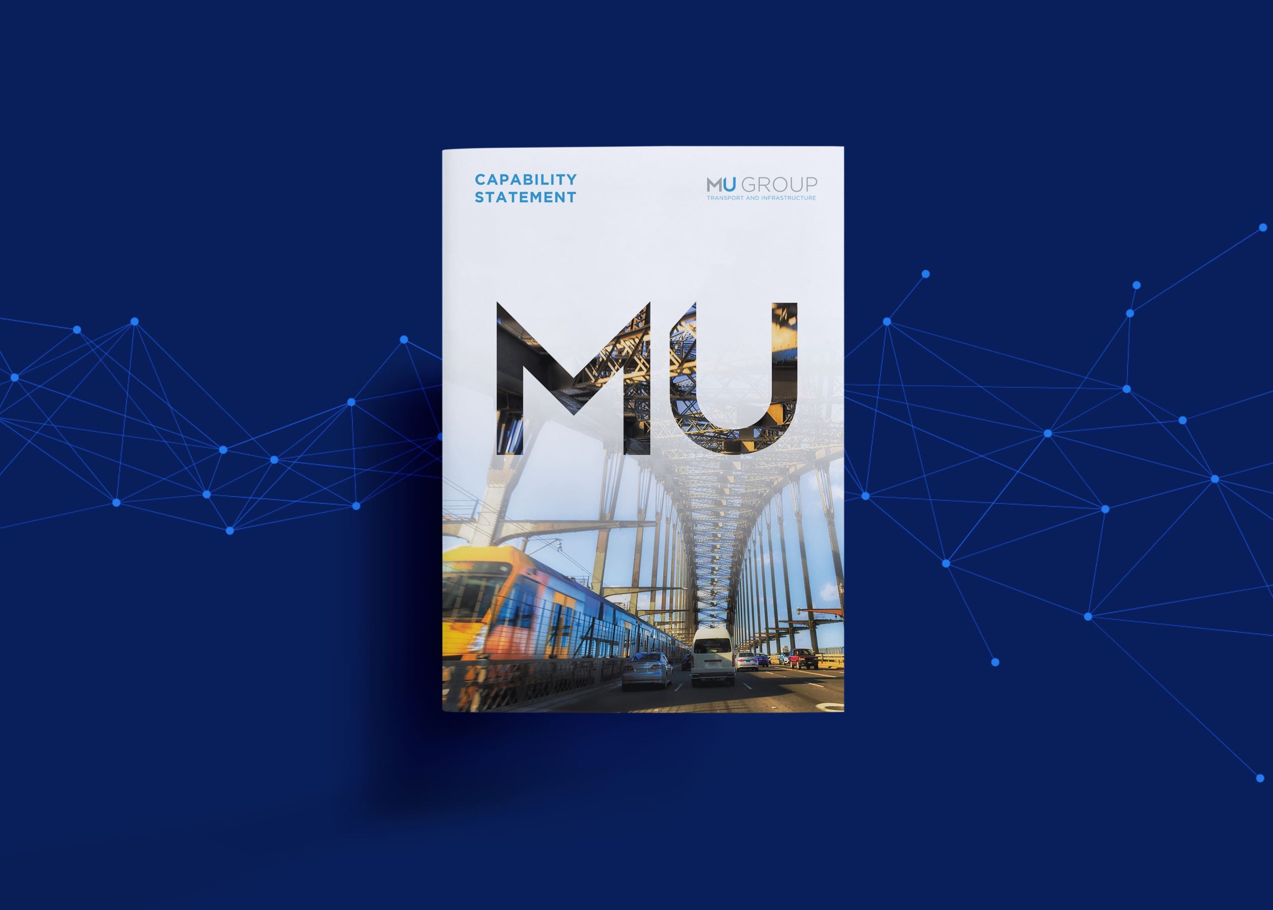 Capability statement brochure for mu group, featuring a cover design with a large 'mu' logo overlaid on an image of a busy train and an architectural bridge structure.